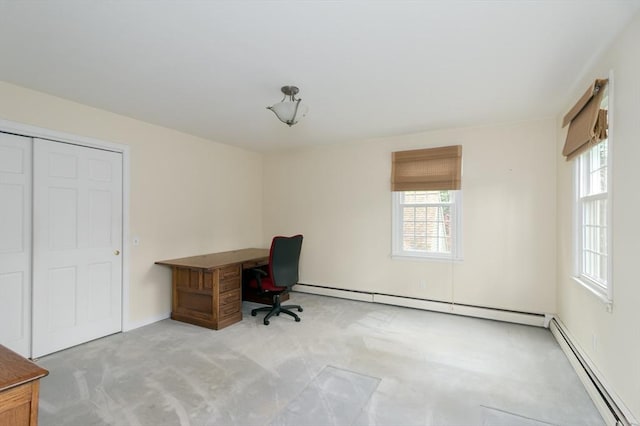 unfurnished office featuring carpet flooring, baseboard heating, and healthy amount of natural light