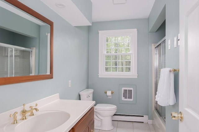 bathroom with a baseboard heating unit, vanity, tile patterned floors, toilet, and shower / bath combination with glass door