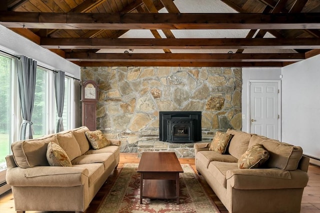 living area featuring wood finished floors, a baseboard heating unit, and wood ceiling