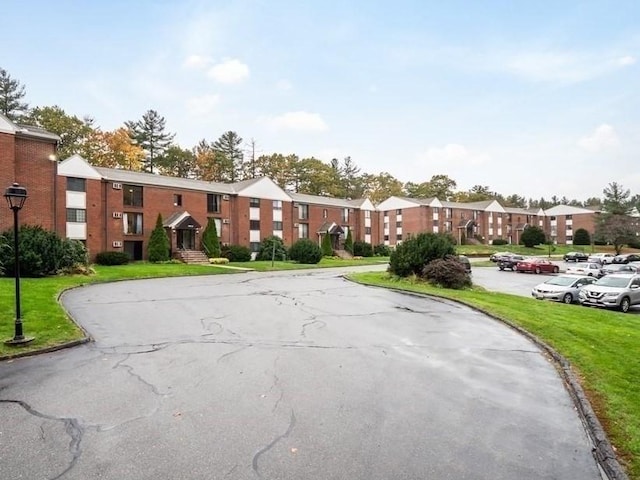 382 Great Rd Unit B 203, Acton, MA 01720 - view of asphalt road featuring curbs and street lighting