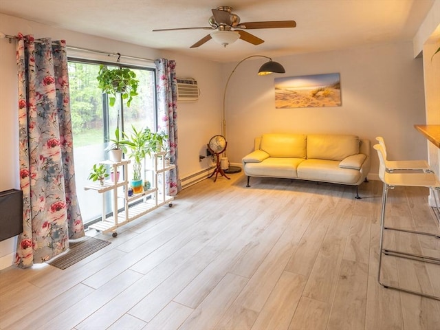 382 Great Rd Unit B 203, Acton, MA 01720 - living area featuring wood finished floors, ceiling fan, baseboards, and a wall mounted AC