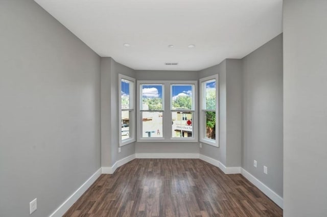 1907 Columbus Ave, Boston, MA 02119 - empty room featuring baseboards and dark wood-style flooring