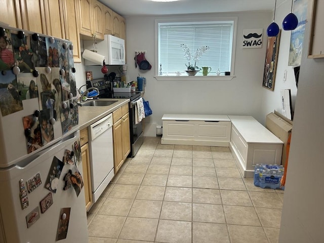 64 Bryon Rd Unit 1, Boston, MA 02467 - kitchen with white appliances, light tile patterned floors, and light countertops