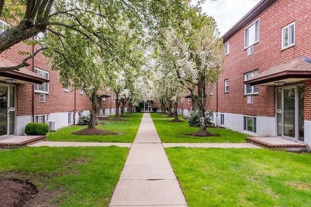 64 Bryon Rd Unit 1, Boston, MA 02467 - view of community with a yard and a residential view