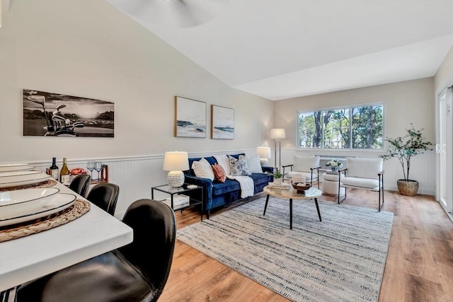 81 Fletcher Ln Unit I, Brewster, MA 02631 - living room with light wood-style floors, a wainscoted wall, and lofted ceiling