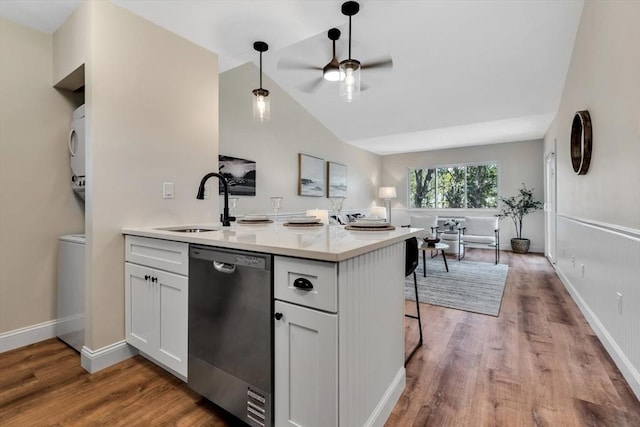 81 Fletcher Ln Unit I, Brewster, MA 02631 - kitchen featuring dishwasher, a ceiling fan, a peninsula, wood finished floors, and vaulted ceiling