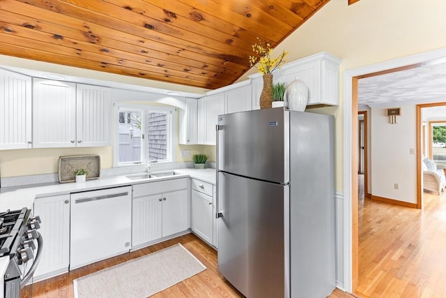 5 S Blvd, Wareham, MA 02558 - kitchen with appliances with stainless steel finishes, a sink, vaulted ceiling, light wood-type flooring, and light countertops