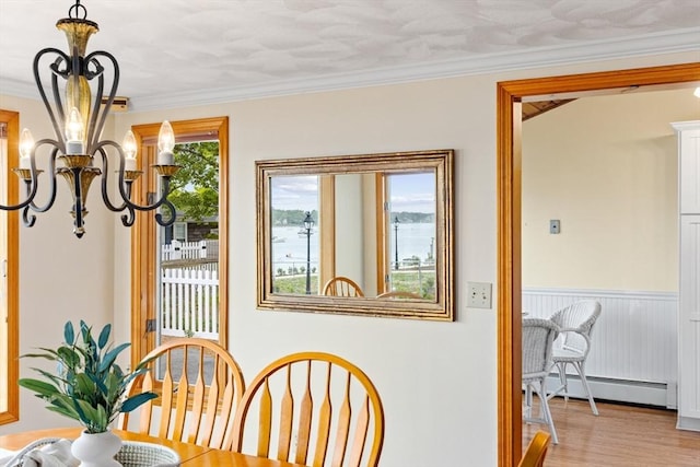 5 S Blvd, Wareham, MA 02558 - dining area featuring a baseboard radiator, a chandelier, crown molding, and wood finished floors