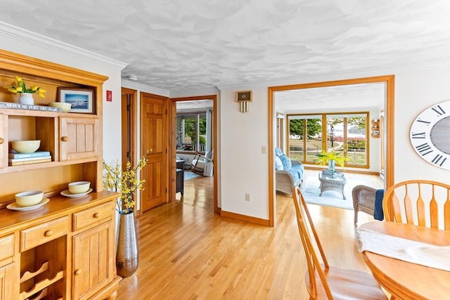 5 S Blvd, Wareham, MA 02558 - dining room featuring light wood-style flooring, healthy amount of natural light, baseboards, and ornamental molding