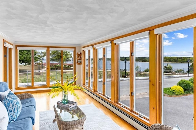5 S Blvd, Wareham, MA 02558 - sunroom / solarium featuring a baseboard radiator, a water view, ornamental molding, and wood finished floors