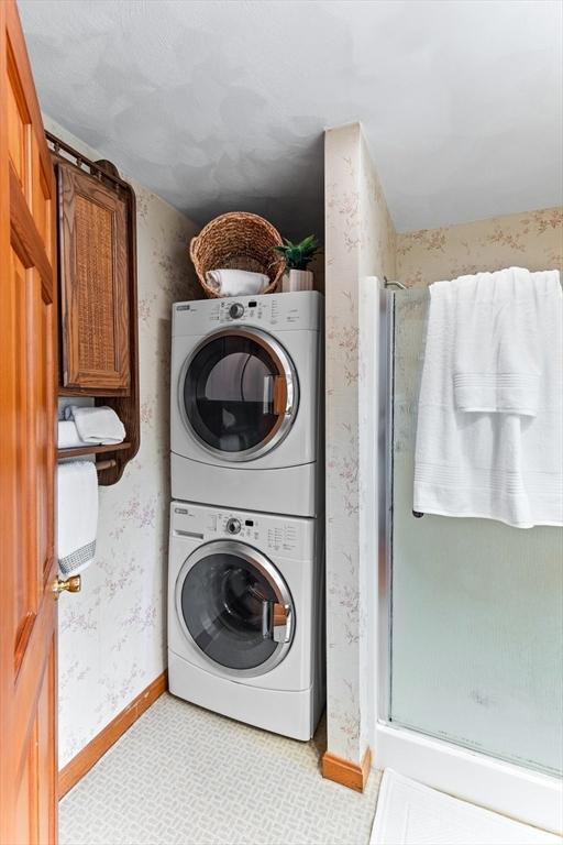5 S Blvd, Wareham, MA 02558 - washroom with stacked washer / dryer, baseboards, and wallpapered walls