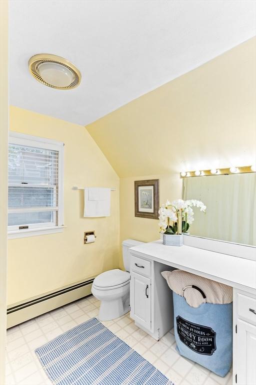 5 S Blvd, Wareham, MA 02558 - bathroom featuring a baseboard radiator, toilet, vanity, and lofted ceiling