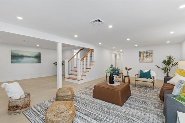 living room with light hardwood / wood-style flooring