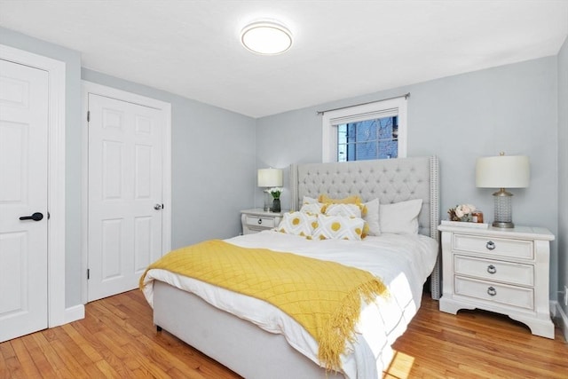 bedroom featuring light wood finished floors