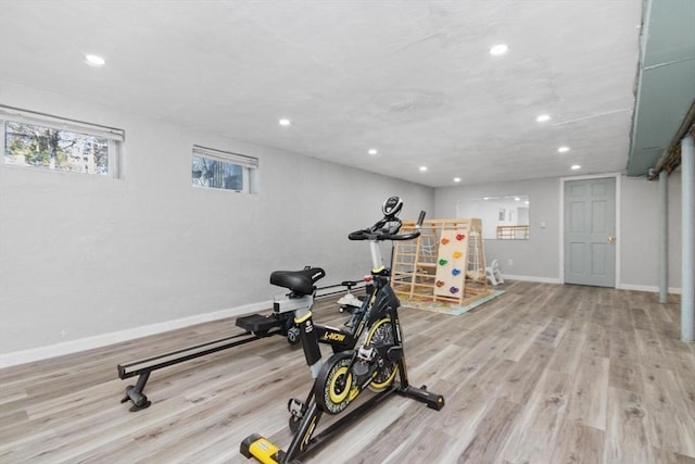 exercise room with recessed lighting, baseboards, and wood finished floors