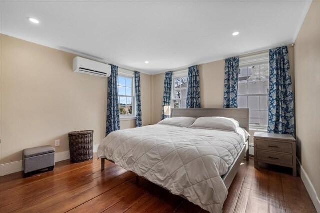 12 Salem St Unit 2, Haverhill, MA 01835 - bedroom with baseboards, recessed lighting, an AC wall unit, and hardwood / wood-style flooring