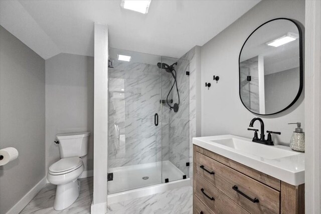 12 Salem St Unit 2, Haverhill, MA 01835 - bathroom with a marble finish shower, marble finish floor, toilet, and baseboards
