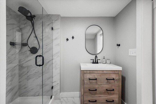 12 Salem St Unit 2, Haverhill, MA 01835 - bathroom with marble finish floor, baseboards, vanity, and a marble finish shower
