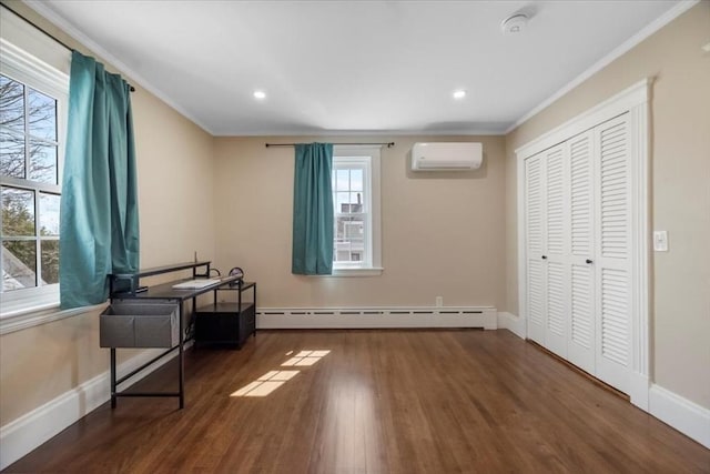 12 Salem St Unit 2, Haverhill, MA 01835 - bedroom with ornamental molding, wood finished floors, an AC wall unit, and baseboard heating