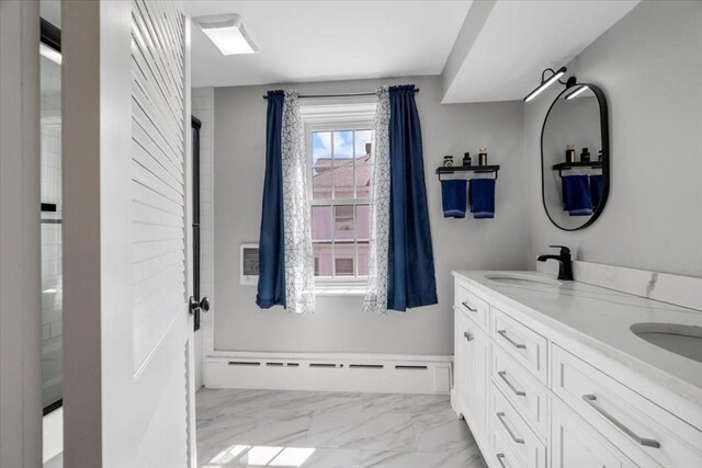 12 Salem St Unit 2, Haverhill, MA 01835 - full bath with marble finish floor, double vanity, baseboard heating, and a sink