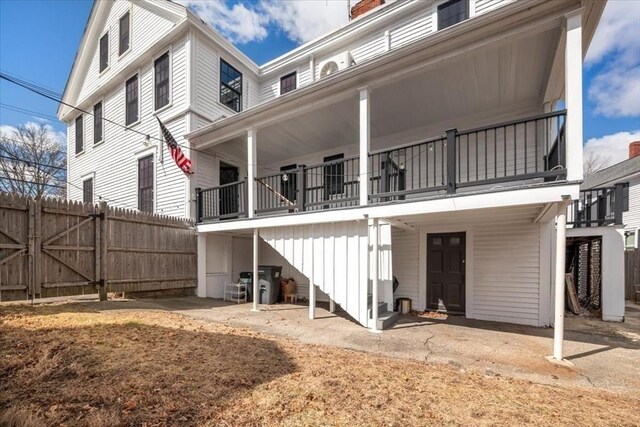 12 Salem St Unit 2, Haverhill, MA 01835 - rear view of house with a gate and fence