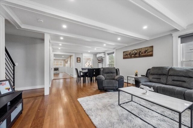 12 Salem St Unit 2, Haverhill, MA 01835 - living room featuring beamed ceiling, hardwood / wood-style flooring, baseboards, a baseboard heating unit, and an AC wall unit