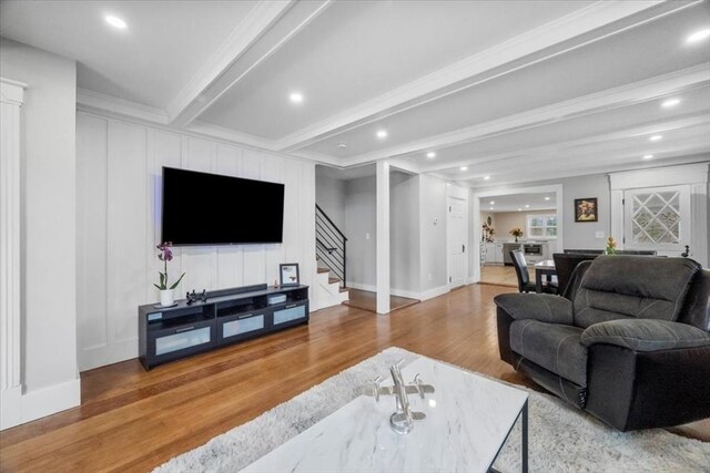 12 Salem St Unit 2, Haverhill, MA 01835 - living area featuring a decorative wall, wood finished floors, beam ceiling, and stairway