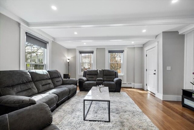 12 Salem St Unit 2, Haverhill, MA 01835 - living room featuring baseboards, beamed ceiling, a baseboard heating unit, and wood finished floors