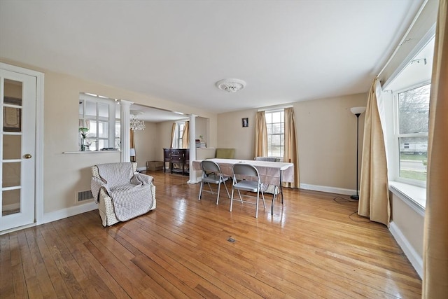 1 Chapin Cir, Randolph, MA 02368 - dining room with plenty of natural light, light wood-style flooring, baseboards, and ornate columns