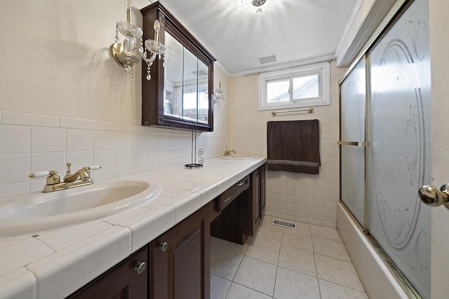 1 Chapin Cir, Randolph, MA 02368 - full bath featuring double vanity, tile walls, tile patterned floors, and combined bath / shower with glass door