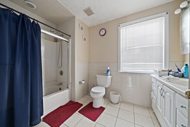 1 Chapin Cir, Randolph, MA 02368 - bathroom featuring vanity, toilet, shower / bathtub combination with curtain, a wainscoted wall, and tile patterned floors