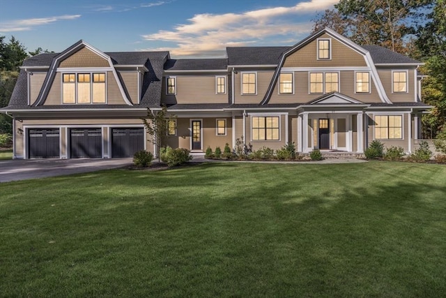 view of front facade with a front lawn and a garage