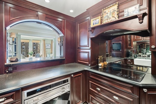 300 Boylston St Unit 517, Boston, MA 02116 - bar area featuring arched walkways, black electric cooktop, crown molding, oven, and recessed lighting