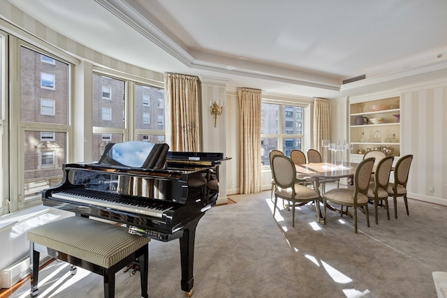 misc room featuring light carpet, a raised ceiling, and ornamental molding