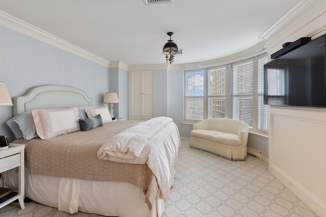 bedroom featuring ornamental molding and multiple windows