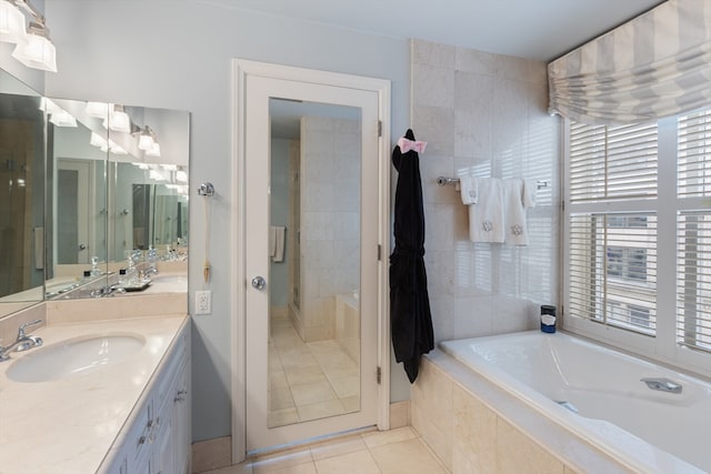 bathroom featuring vanity, tile patterned floors, and shower with separate bathtub