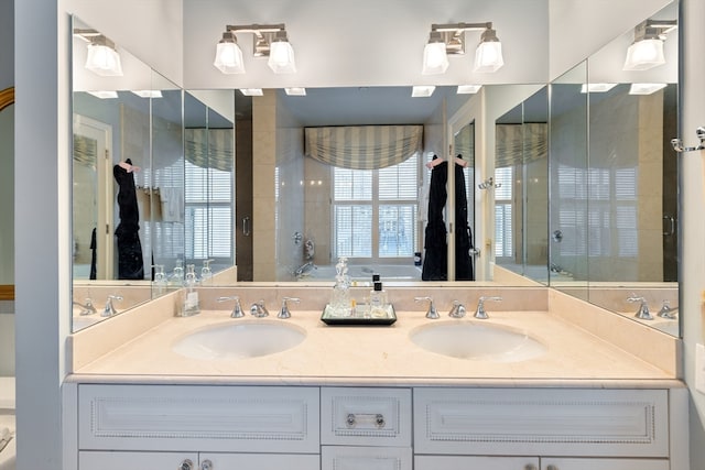 bathroom featuring vanity and separate shower and tub