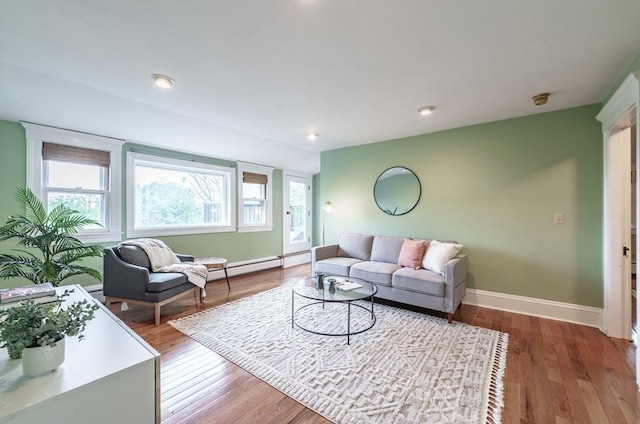 61 Crescent St Unit 6, Northampton, MA 01060 - living area featuring baseboards, wood finished floors, and a baseboard radiator