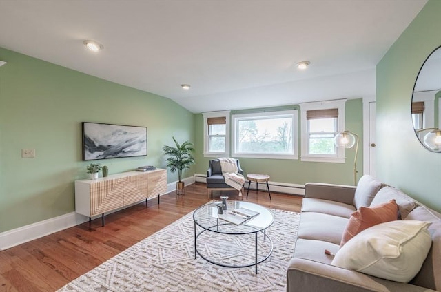 61 Crescent St Unit 6, Northampton, MA 01060 - living area featuring a baseboard radiator, a baseboard heating unit, lofted ceiling, wood finished floors, and baseboards