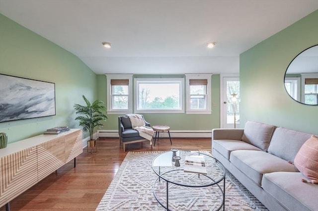 61 Crescent St Unit 6, Northampton, MA 01060 - living room with a baseboard heating unit, healthy amount of natural light, wood finished floors, and lofted ceiling