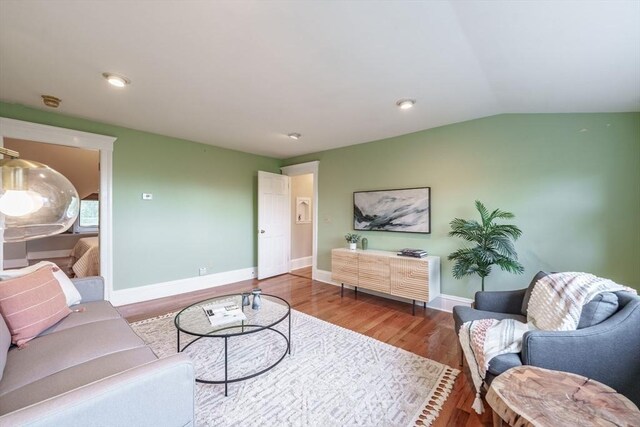 61 Crescent St Unit 6, Northampton, MA 01060 - living room featuring wood finished floors, vaulted ceiling, and baseboards