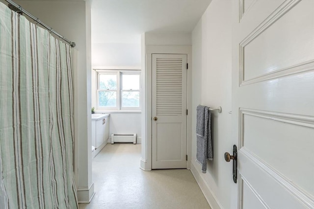 61 Crescent St Unit 6, Northampton, MA 01060 - bathroom featuring a baseboard radiator, vanity, baseboards, and curtained shower