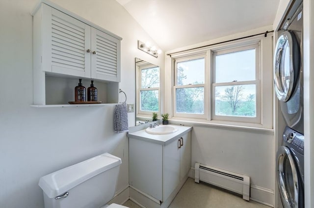 61 Crescent St Unit 6, Northampton, MA 01060 - half bathroom featuring a baseboard heating unit, estacked washer and dryer, lofted ceiling, vanity, and toilet
