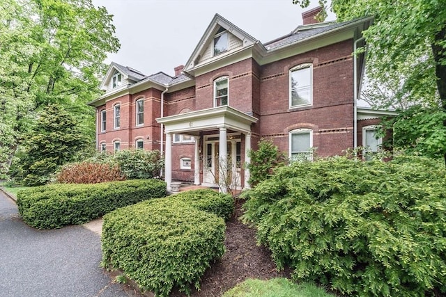 61 Crescent St Unit 6, Northampton, MA 01060 - victorian house featuring brick siding and a chimney