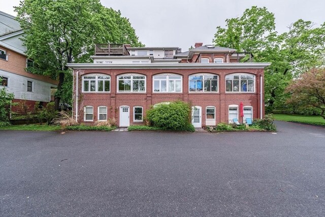 61 Crescent St Unit 6, Northampton, MA 01060 - view of front of house featuring brick siding and a chimney