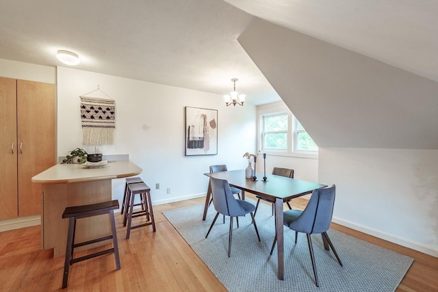 61 Crescent St Unit 6, Northampton, MA 01060 - dining space featuring light wood-style floors, a chandelier, and baseboards