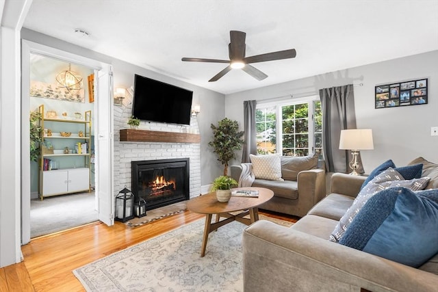 212 Broadway St, Wakefield, MA 01880 - living room featuring a ceiling fan, a fireplace, and wood finished floors