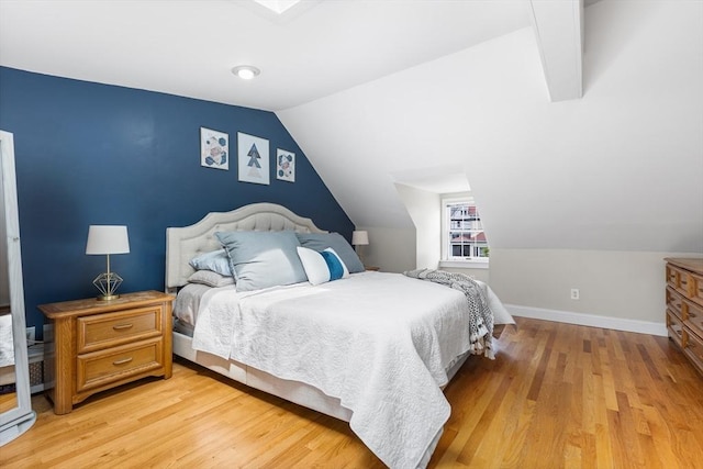 212 Broadway St, Wakefield, MA 01880 - bedroom featuring vaulted ceiling, light wood-style flooring, and baseboards