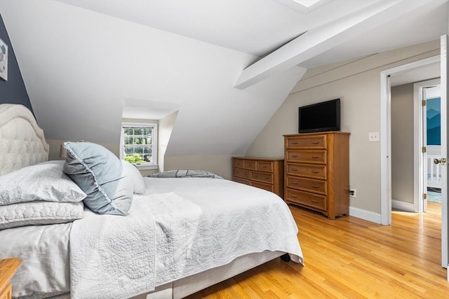 212 Broadway St, Wakefield, MA 01880 - bedroom with light wood-style floors, vaulted ceiling, and baseboards