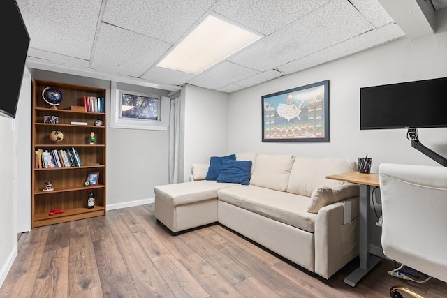 212 Broadway St, Wakefield, MA 01880 - living area with wood finished floors, a drop ceiling, and baseboards